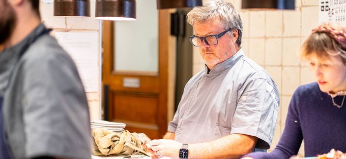 Frank McClelland in chef whites at the pass